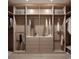 Organized walk-in closet featuring custom shelves, drawers, and hanging rods, perfect for storage at 110 W Railway Ave, Oakland, FL 34760