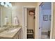 Bright bathroom featuring granite countertop, closet, and access to the main bedroom area at 1687 Kona Ln, Davenport, FL 33897