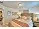 Comfortable bedroom featuring a queen bed, cozy decor, and abundant natural light at 1687 Kona Ln, Davenport, FL 33897