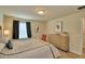 Comfortable bedroom featuring modern furniture, neutral walls, and wood-look flooring at 1687 Kona Ln, Davenport, FL 33897