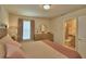 Comfortable bedroom suite with a walk-in closet, neutral decor, and an ensuite bathroom at 1687 Kona Ln, Davenport, FL 33897