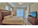 Bedroom with ample natural light, en-suite bathroom, and spacious closet at 1687 Kona Ln, Davenport, FL 33897