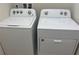 Laundry area includes a Whirlpool washer and dryer at 1687 Kona Ln, Davenport, FL 33897