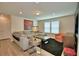 Comfortable living room with modern lighting, contemporary decor, and a plush sectional sofa at 1687 Kona Ln, Davenport, FL 33897