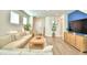 Inviting living room with stylish furnishings, a media console, and ample natural light at 1687 Kona Ln, Davenport, FL 33897