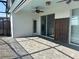 A covered patio featuring brick pavers, a ceiling fan, and easy access to the outdoor living area at 1687 Kona Ln, Davenport, FL 33897