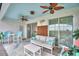 Outdoor patio with ceiling fans, comfortable seating, and view of the backyard at 1687 Kona Ln, Davenport, FL 33897