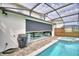 Private screened pool featuring an adjacent patio for relaxing and entertaining Gathering and friends at 1687 Kona Ln, Davenport, FL 33897