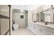 Elegant bathroom with double vanity, soaking tub, and updated fixtures at 7972 Snowberry Cir, Orlando, FL 32819