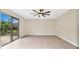Bright bedroom with sliding glass door to backyard at 7972 Snowberry Cir, Orlando, FL 32819