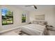 Bedroom with large windows and ceiling fan at 7972 Snowberry Cir, Orlando, FL 32819