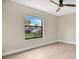 Light and airy bedroom with large window and ceiling fan at 7972 Snowberry Cir, Orlando, FL 32819