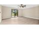 Bedroom with sliding glass doors and a view at 7972 Snowberry Cir, Orlando, FL 32819