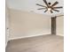 Spacious bedroom with ceiling fan and sliding barn door at 7972 Snowberry Cir, Orlando, FL 32819