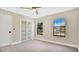 Bedroom with two windows, closet and wood flooring at 7972 Snowberry Cir, Orlando, FL 32819