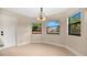 Breakfast nook with chandelier and windows at 7972 Snowberry Cir, Orlando, FL 32819