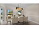Dining room with chandelier and large windows at 7972 Snowberry Cir, Orlando, FL 32819