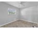 Well-lit bedroom with neutral walls, carpet flooring, and a ceiling fan at 107 Hickory Tree Rd, Longwood, FL 32750