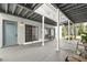 Condo with covered walkways and painted doors in a gated community at 4878 Conway Rd # 91, Orlando, FL 32812