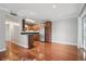 Efficient kitchen with stainless steel appliances, ample wood cabinets, and hardwood floors at 4878 Conway Rd # 91, Orlando, FL 32812