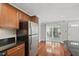 Beautiful kitchen featuring stainless appliances, wood cabinetry, and access to a patio at 4878 Conway Rd # 91, Orlando, FL 32812