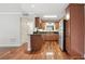 This kitchen features stainless steel appliances, dark countertops and hardwood floors at 4878 Conway Rd # 91, Orlando, FL 32812