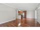 Bright open floor plan featuring a sleek kitchen and hardwood floors at 4878 Conway Rd # 91, Orlando, FL 32812