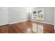 Inviting living space with hardwood floors and a large window providing ample natural light at 4878 Conway Rd # 91, Orlando, FL 32812
