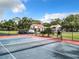 Tennis court with net, ready for a game at 1000 Winderley Pl # 241, Maitland, FL 32751