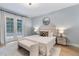 Serene bedroom with neutral color palette and access to the outdoors at 70 Millholland St, Oakland, FL 34760