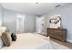 Calm bedroom with soft lighting, ensuite bathroom access, and dresser at 70 Millholland St, Oakland, FL 34760