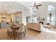 Open floor plan with modern design featuring a large fireplace, natural light, and a dining area at 70 Millholland St, Oakland, FL 34760