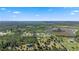 Aerial view of expansive property with multiple buildings and lush greenery at 6799 Chad Jason Rd, Saint Cloud, FL 34773