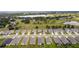 Aerial view of a neighborhood near a lake, showcasing homes with manicured lawns at 10204 Spring Lake Dr, Clermont, FL 34711