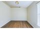 Empty bedroom with laminate wood flooring at 13136 S Ashington Pointe Dr, Orlando, FL 32824