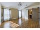 Main bedroom with hardwood floors, barn door, and ensuite bathroom at 13136 S Ashington Pointe Dr, Orlando, FL 32824