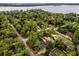 Aerial view of home near water, surrounded by trees at 14315 Conifer Dr, Orlando, FL 32832