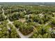 Aerial view showcasing home's location in a wooded area at 14315 Conifer Dr, Orlando, FL 32832