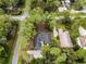 House surrounded by tall trees in a residential area at 14315 Conifer Dr, Orlando, FL 32832