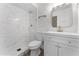 Modern bathroom with marble shower and white cabinetry at 14315 Conifer Dr, Orlando, FL 32832