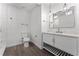 Modern bathroom with white vanity and marble-look tile at 14315 Conifer Dr, Orlando, FL 32832