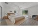 Serene bedroom with natural light and a sliding door, creating a peaceful retreat at 14315 Conifer Dr, Orlando, FL 32832