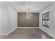 Elegant dining room with a chic textured wall and chandelier at 14315 Conifer Dr, Orlando, FL 32832