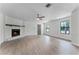 Large living room with fireplace and wood-look floors at 14315 Conifer Dr, Orlando, FL 32832