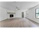 Living room with fireplace and hardwood floors at 14315 Conifer Dr, Orlando, FL 32832