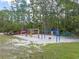 Community playground with swings, slides, and climbing structures at 14315 Conifer Dr, Orlando, FL 32832