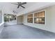 Relaxing screened porch with ceiling fans and exterior access at 14315 Conifer Dr, Orlando, FL 32832