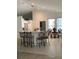 Bright dining area adjacent to the kitchen featuring a breakfast bar and a charming dining table set at 2717 Bayview Dr, Eustis, FL 32726