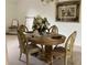 Cozy dining area featuring an oval wooden table with seating for four, complemented by stylish decor at 2717 Bayview Dr, Eustis, FL 32726