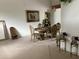 Formal dining area features a decorative chandelier and an elegant wood table with seating for four at 2717 Bayview Dr, Eustis, FL 32726